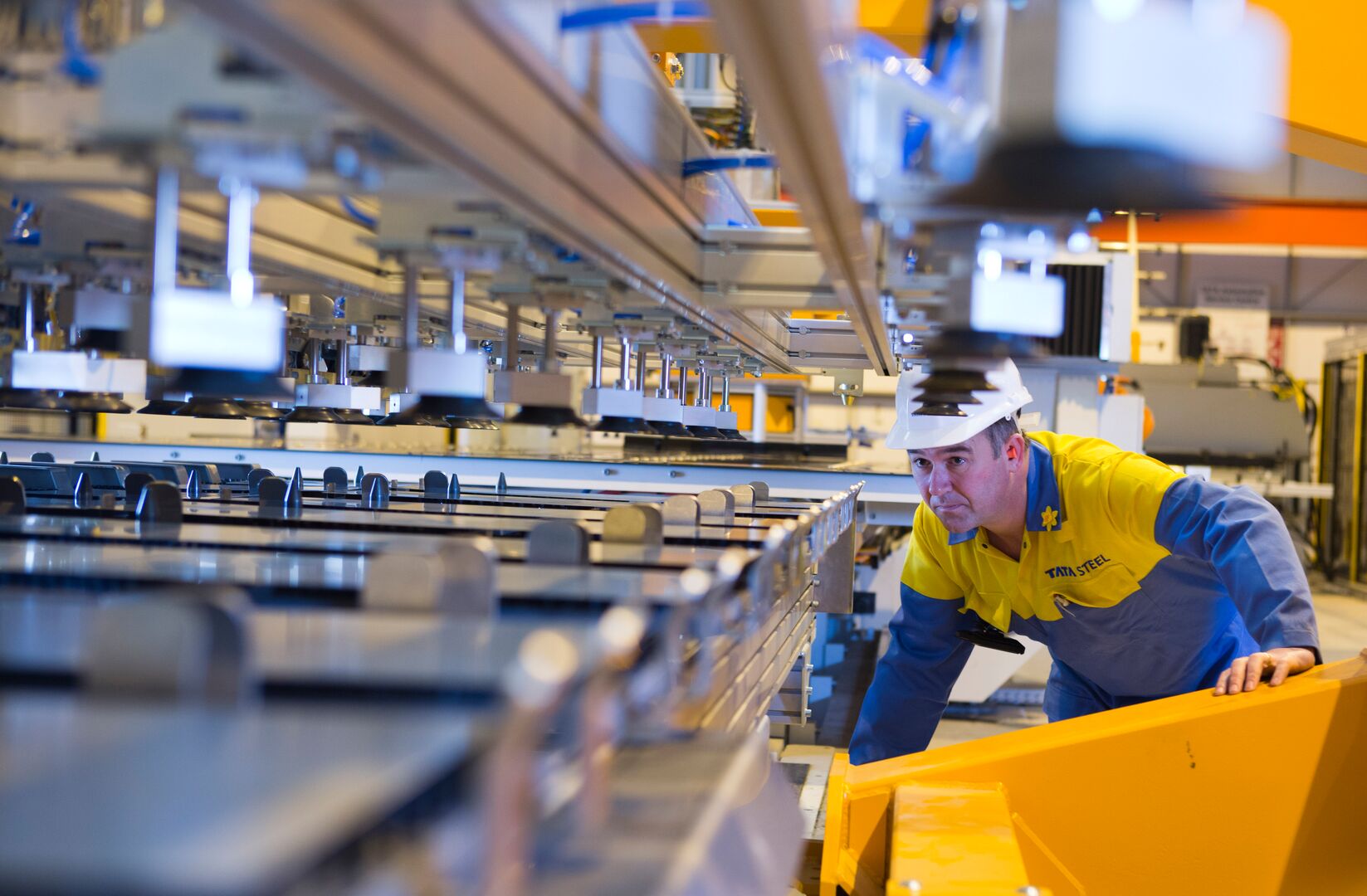 Tata Steel employee examining steel presswork at the Steelpark Automotive Centre